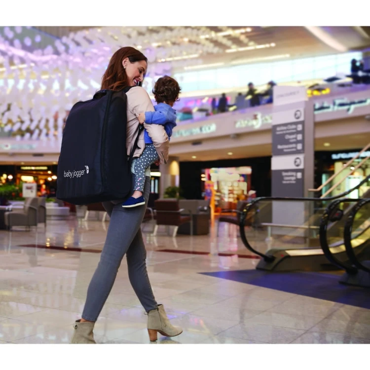 BABY_JOGGER_6JP00-baby-jogger-city-tour-stroller-folded-backpack-mall-in-use.jpg